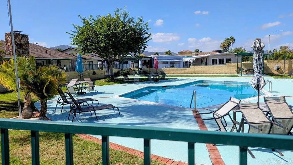 9459 Mission Gorge Road, Unit 68 Santee, CA 92071 - Photo 11 of 13 a view of a house with backyard porch and sitting area
