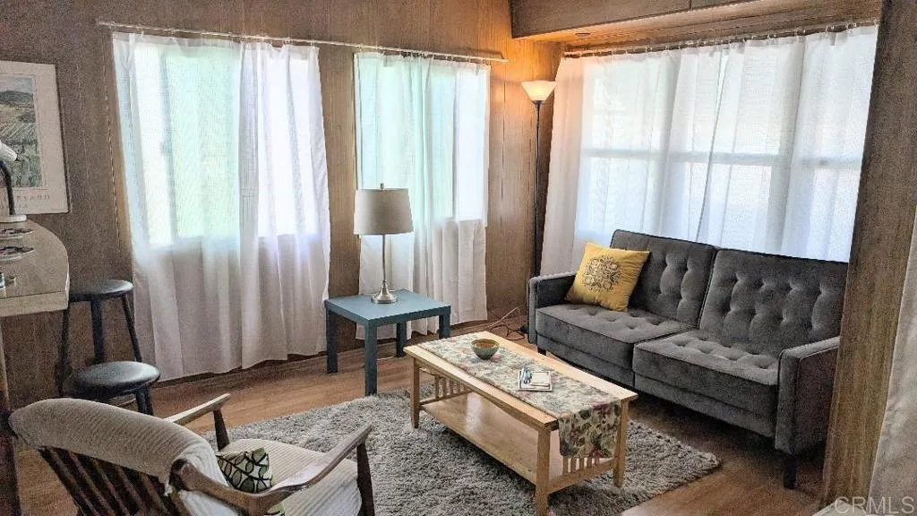 9459 Mission Gorge Road, Unit 68 Santee, CA 92071 - Photo 2 of 13 a living room with furniture and a window