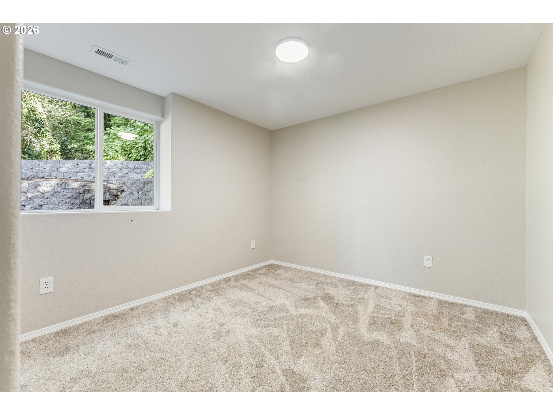 4024 Southeast 154th Place Portland, OR 97236 - Photo 23 of 43 a view of an empty room with a window