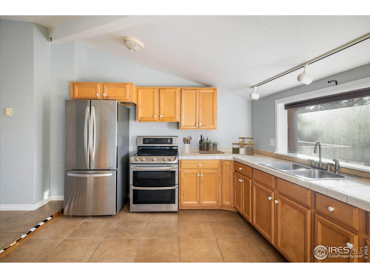 15 Hardscrabble Road Golden, CO 80403 - Photo 12 of 50 a kitchen with a refrigerator and a sink