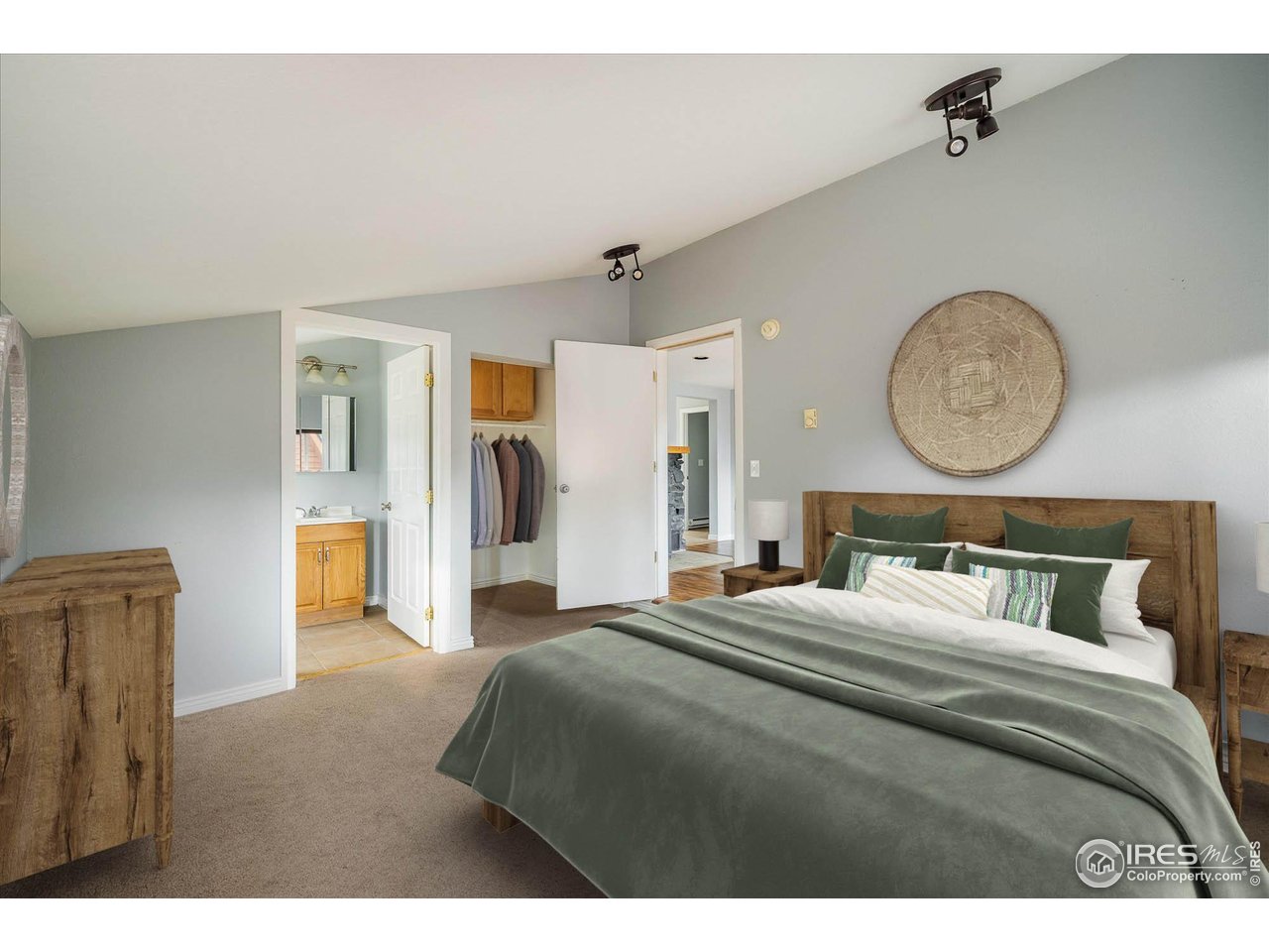 15 Hardscrabble Road Golden, CO 80403 - Photo 19 of 50 a bedroom with a bed a clock on dresser and a window