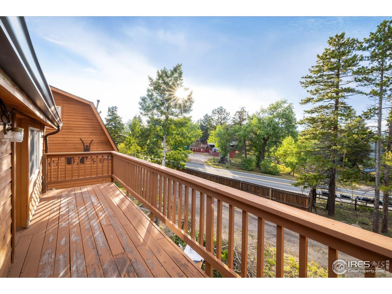 15 Hardscrabble Road Golden, CO 80403 - Photo 22 of 50 a view of balcony with wooden floor and fence