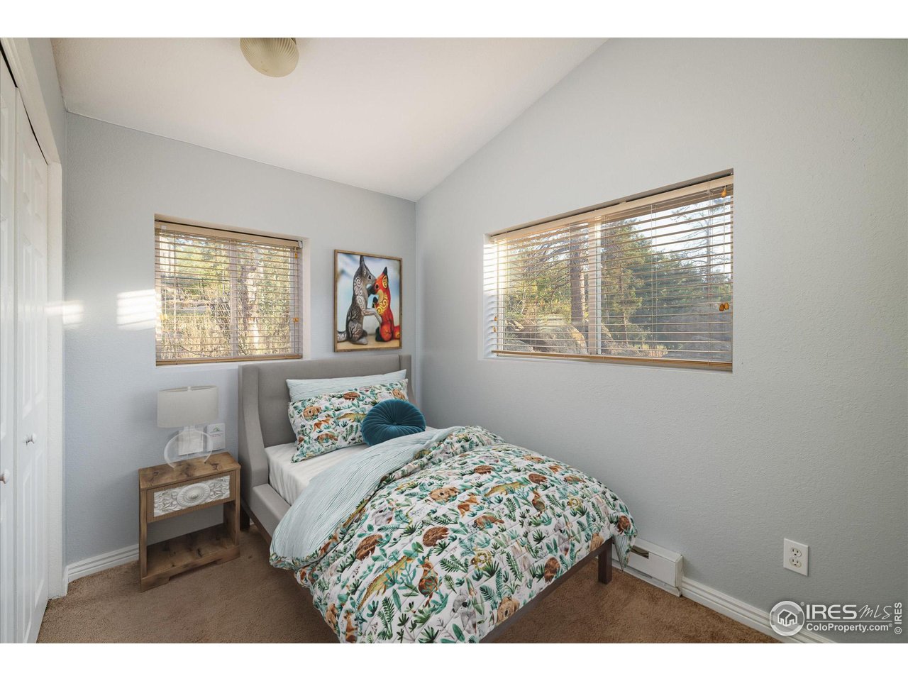 15 Hardscrabble Road Golden, CO 80403 - Photo 24 of 50 a bedroom with a bed and a painting on the wall