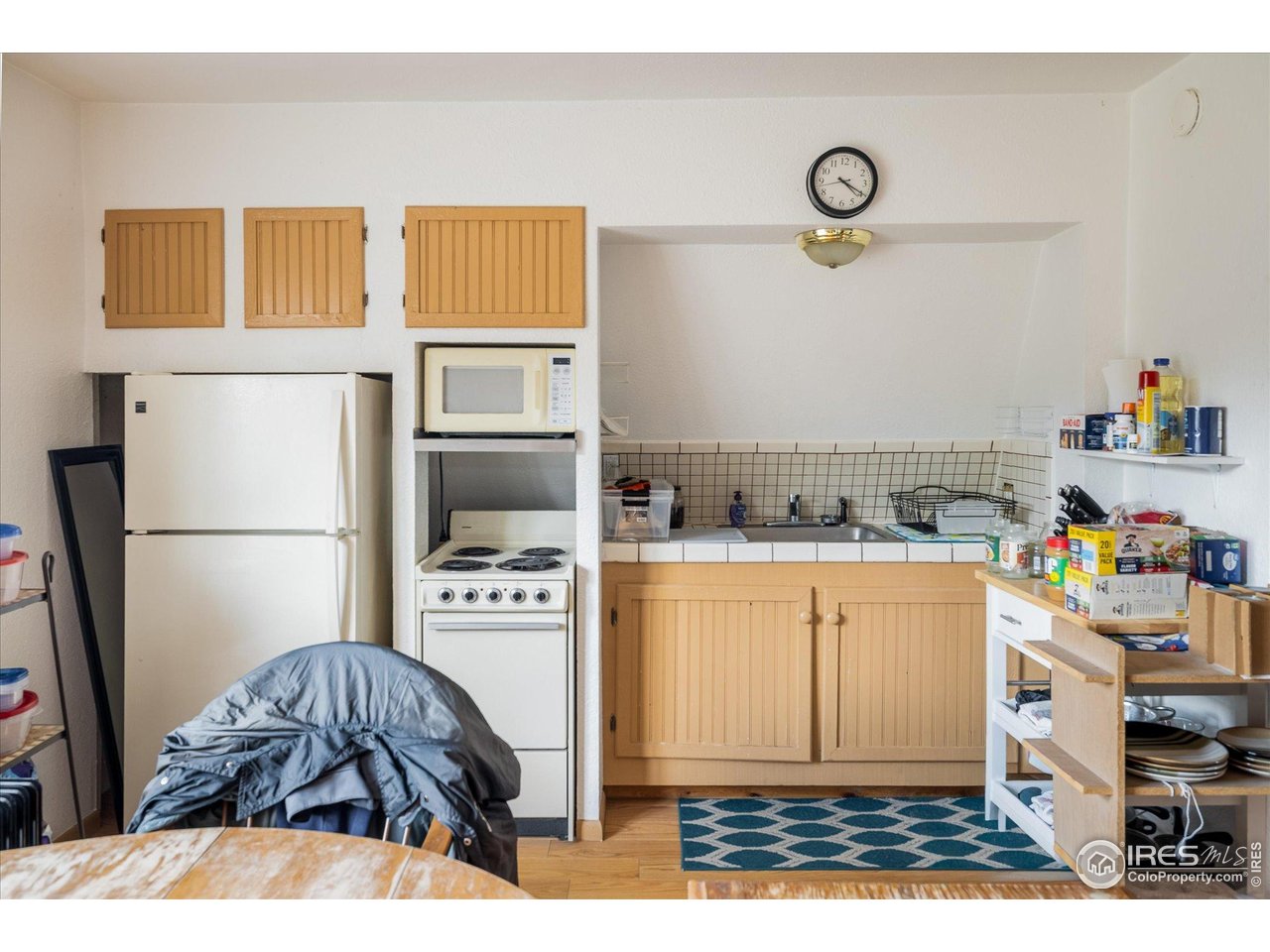 15 Hardscrabble Road Golden, CO 80403 - Photo 34 of 50 a bedroom with a bed and a refrigerator