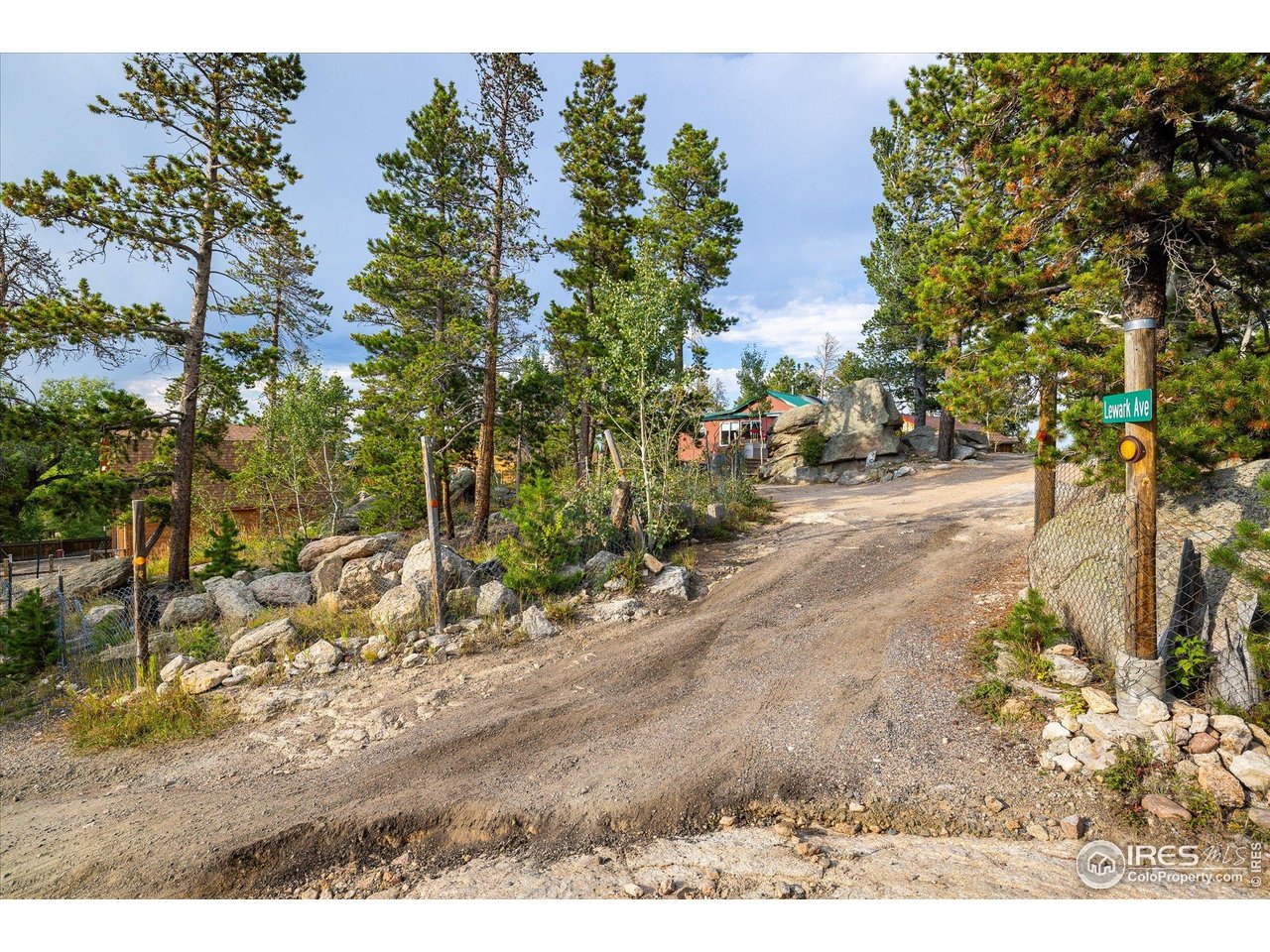 15 Hardscrabble Road Golden, CO 80403 - Photo 39 of 50 a view of a dirt road with a building in the background