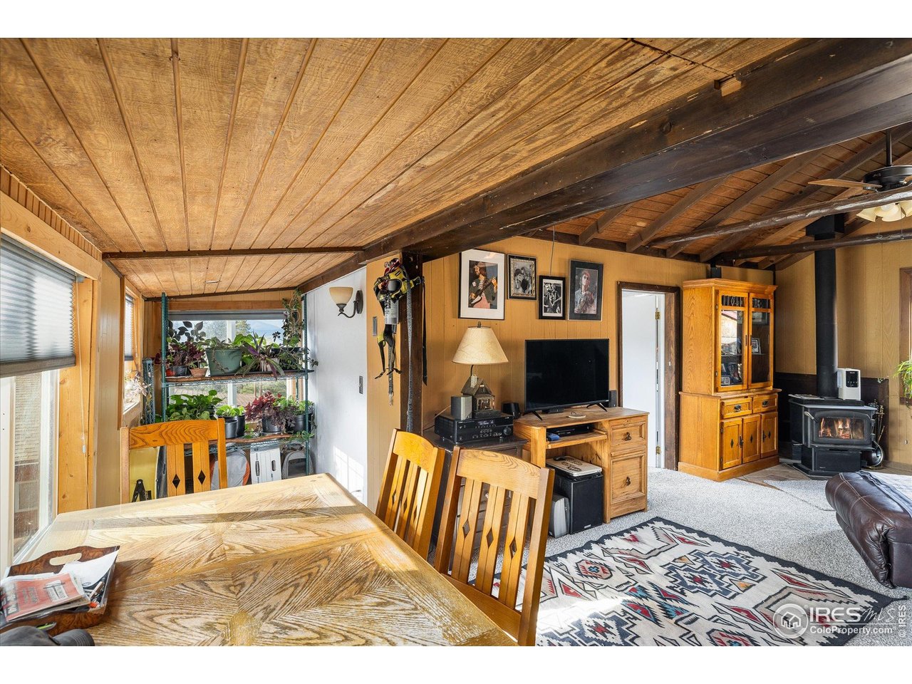 15 Hardscrabble Road Golden, CO 80403 - Photo 43 of 50 a living room with furniture and a flat screen tv