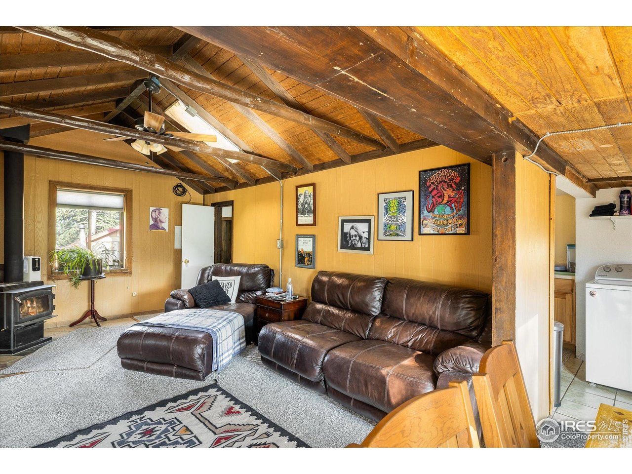 15 Hardscrabble Road Golden, CO 80403 - Photo 44 of 50 a living room with furniture and a flat screen tv