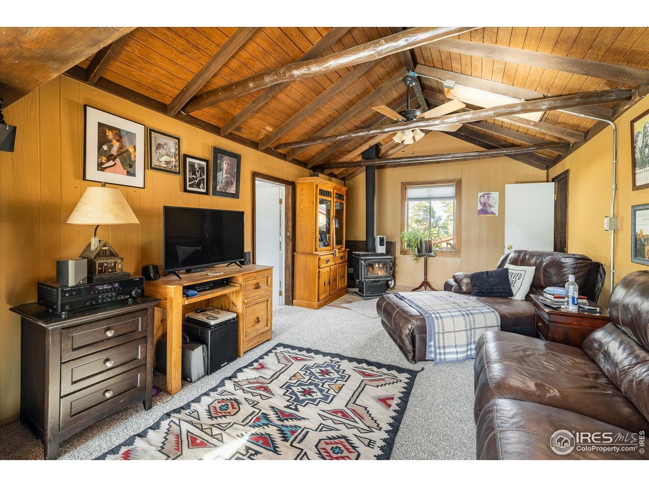 15 Hardscrabble Road Golden, CO 80403 - Photo 45 of 50 a living room with furniture and a flat screen tv