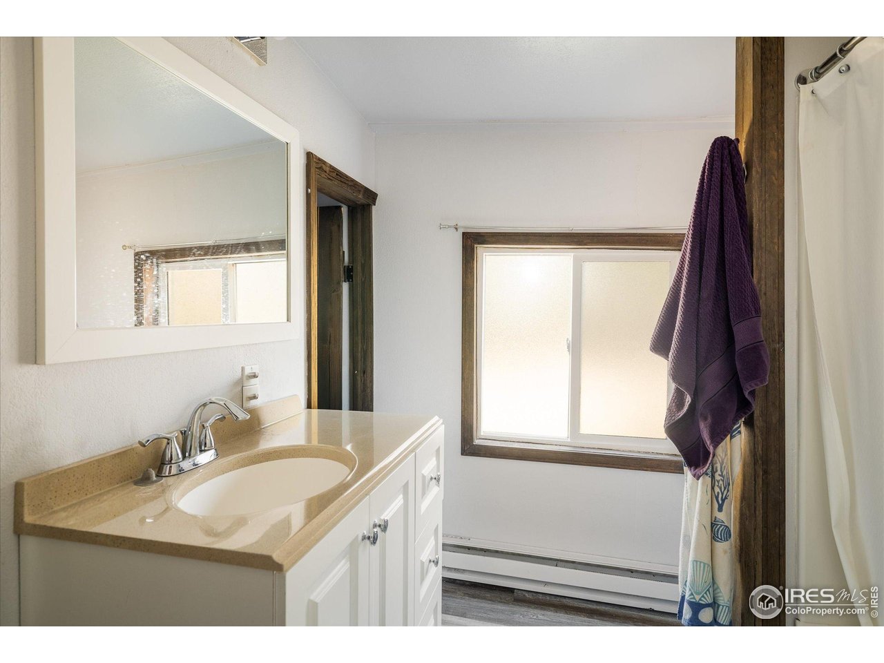 15 Hardscrabble Road Golden, CO 80403 - Photo 50 of 50 a bathroom with a sink vanity and a mirror