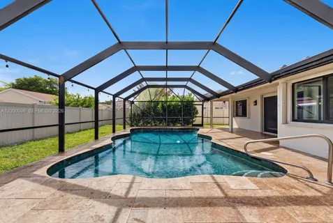 a view of swimming pool with seating area