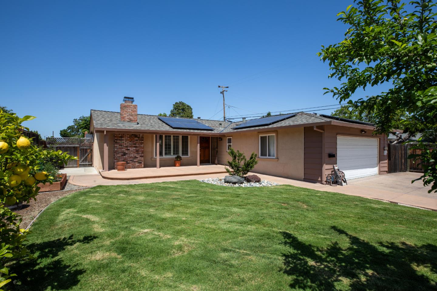 1937 Adelaide Way San Jose, CA 95124 - Photo 3 of 33 a front view of a house with a garden and trees