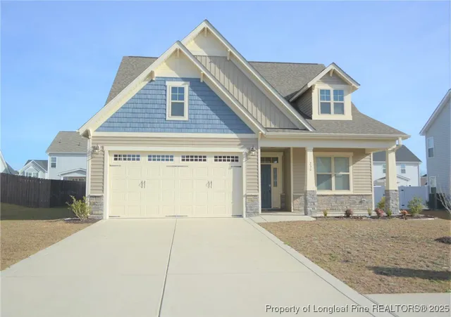 a view of a white house with large windows