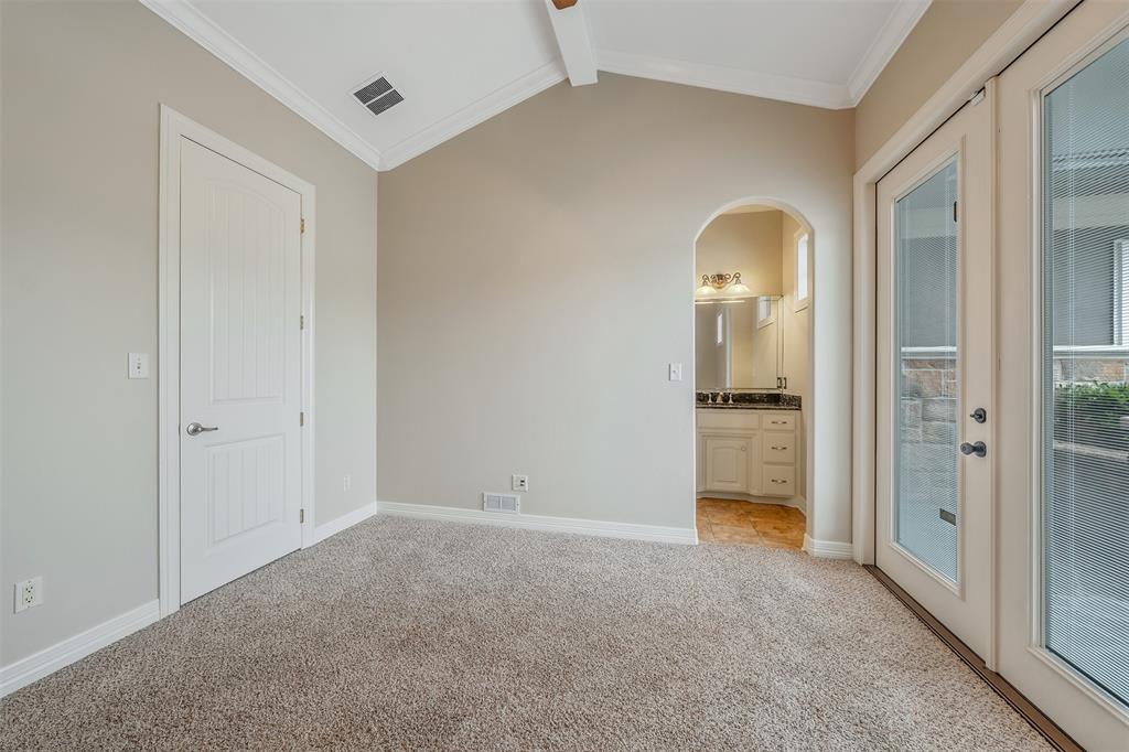 20389 County Road 178 Flint, TX 75762 - Photo 18 of 40 Vaulted ceiling with white crown molding, light-colored carpet flooring, and a six-panel interior door