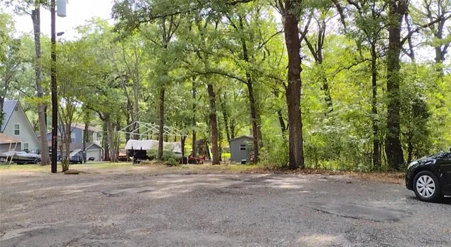 a view of outdoor space with deck and trees