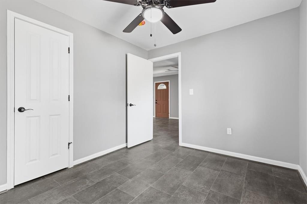 409 Calhoun Avenue Northeast Rome, GA 30161 - Photo 21 of 25 a view of a livingroom with a ceiling fan