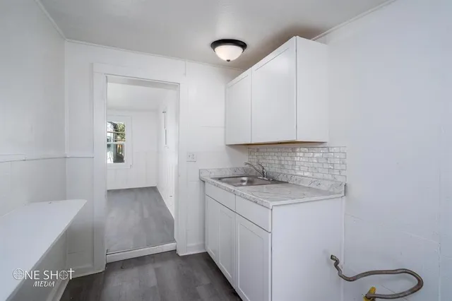 a view of cabinets and wooden floor