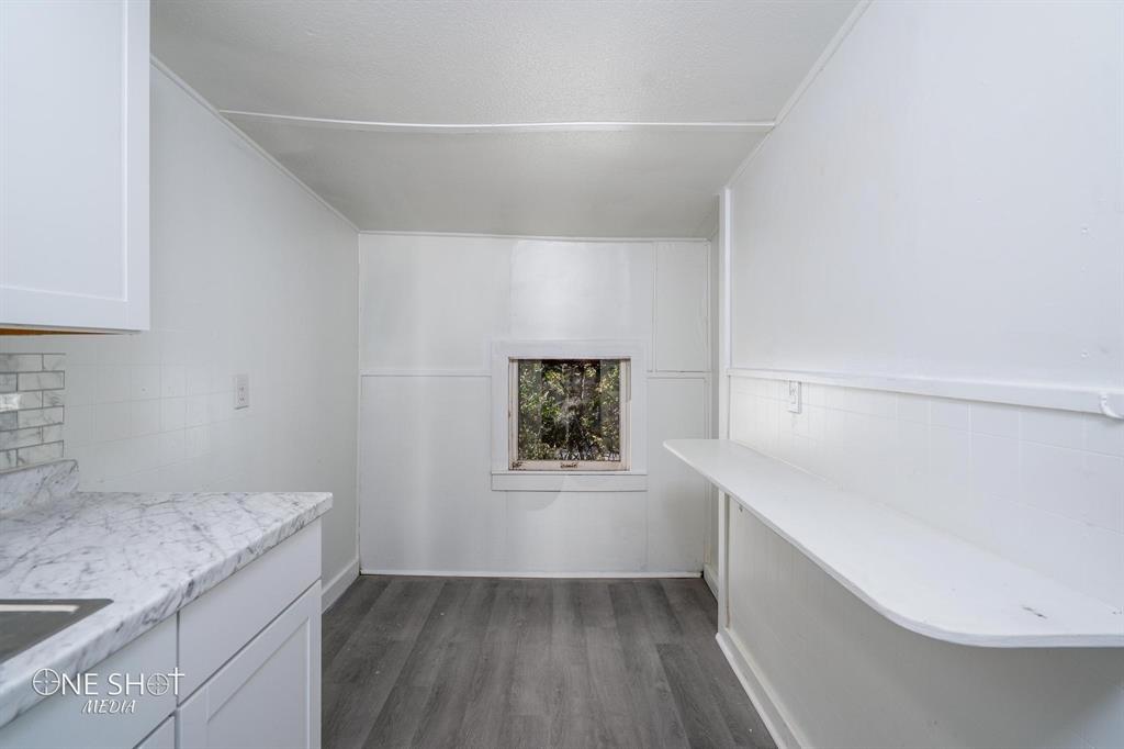 1909 Highland Avenue Abilene, TX 79605 - Photo 18 of 23 a hallway with a wooden floor and entryway