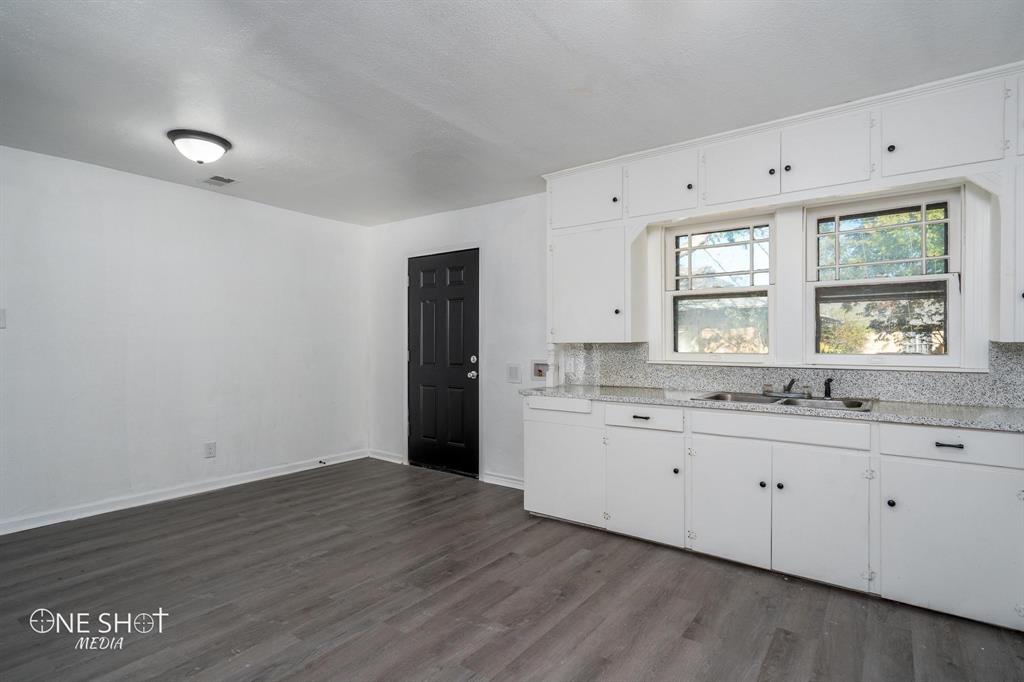 1909 Highland Avenue Abilene, TX 79605 - Photo 5 of 23 a bathroom with a sink and a mirror