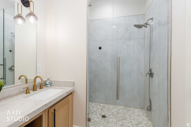 1188 South Old Trappers Loop Road Huntsville, UT 84317 - Photo 43 of 92 Glass-enclosed shower featuring large format tile surround and pebble tile flooring