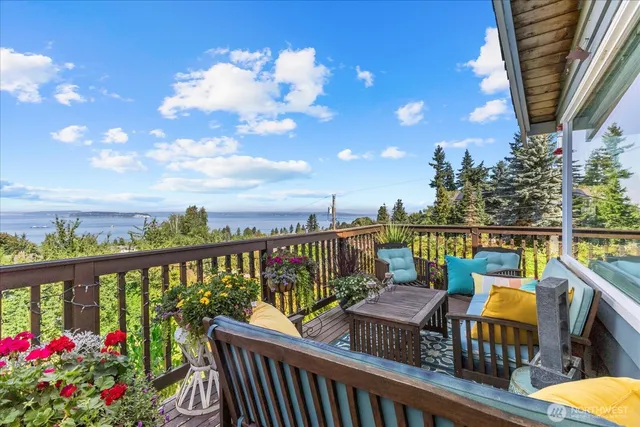 a view of a balcony with outdoor seating