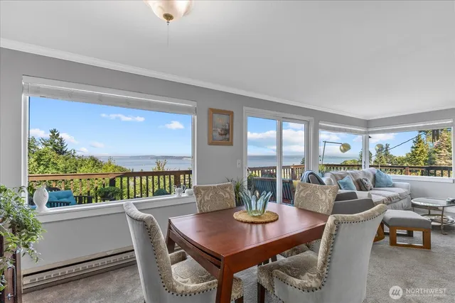 a view of a dining room with furniture window and outside view