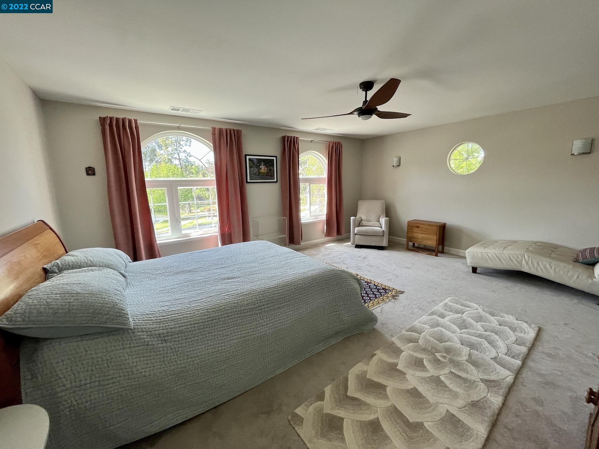 4387 Fallbrook Road Concord, CA 94521 - Photo 11 of 26 a bedroom with a bed and ceiling fan