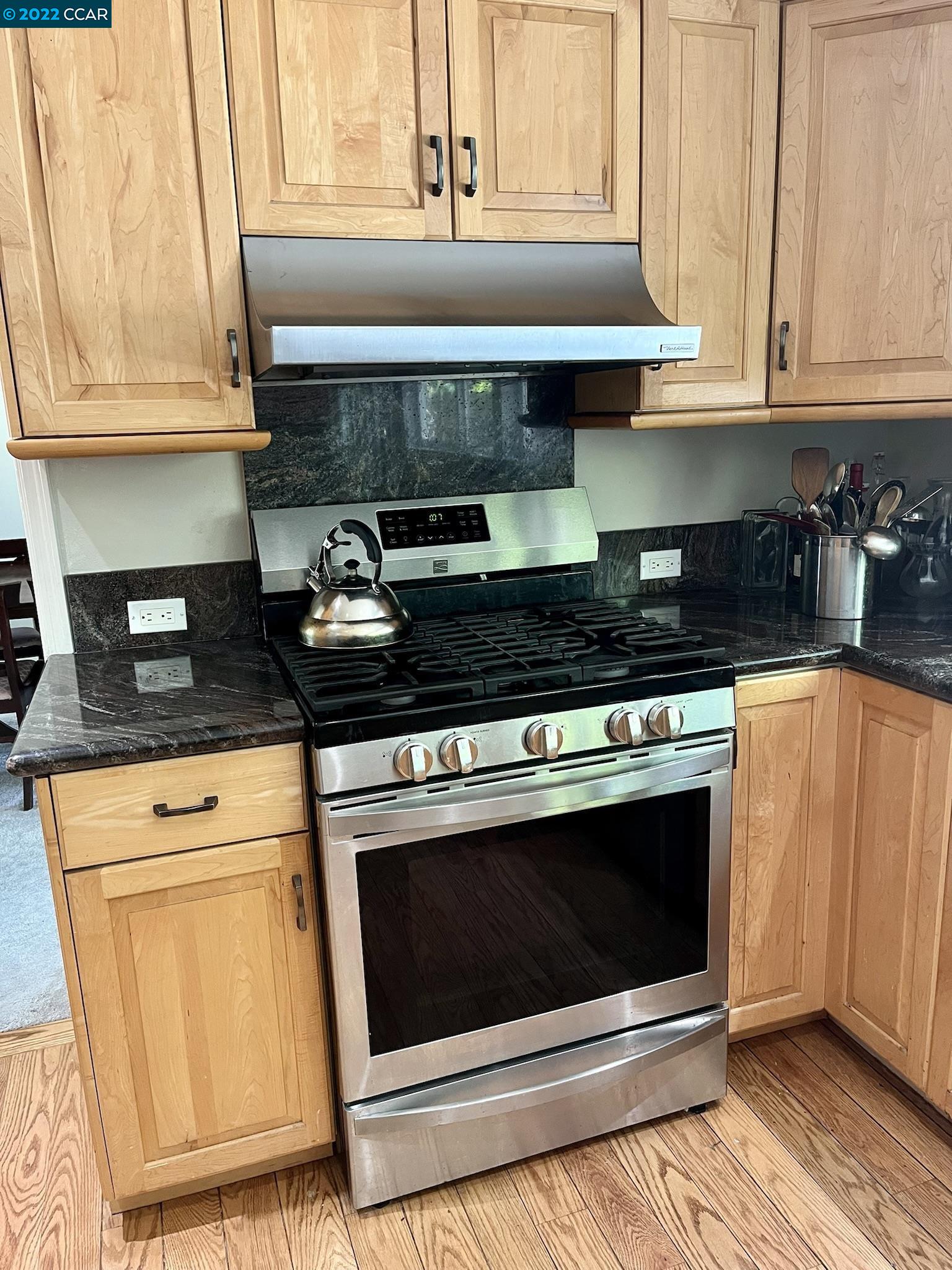 4387 Fallbrook Road Concord, CA 94521 - Photo 6 of 26 a stove top oven sitting inside of a kitchen