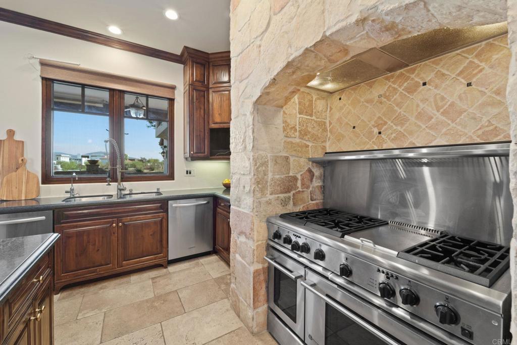 2908 Gate 5 Place Chula Vista, CA 91914 - Photo 26 of 63 a kitchen with a stove and a sink