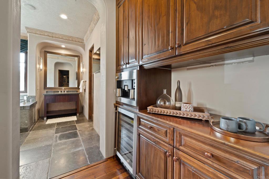 2908 Gate 5 Place Chula Vista, CA 91914 - Photo 31 of 63 a kitchen with granite countertop a cabinets and washing machine