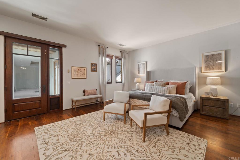 2908 Gate 5 Place Chula Vista, CA 91914 - Photo 32 of 63 a bedroom with a bed and wooden floor