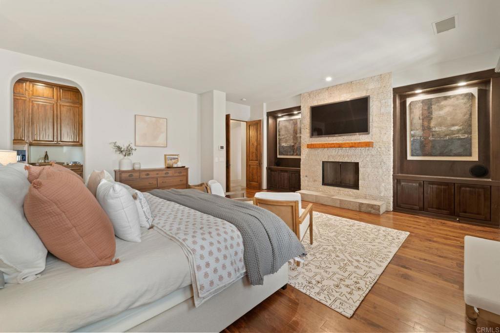 2908 Gate 5 Place Chula Vista, CA 91914 - Photo 34 of 63 a bedroom with a large bed and a flat screen tv