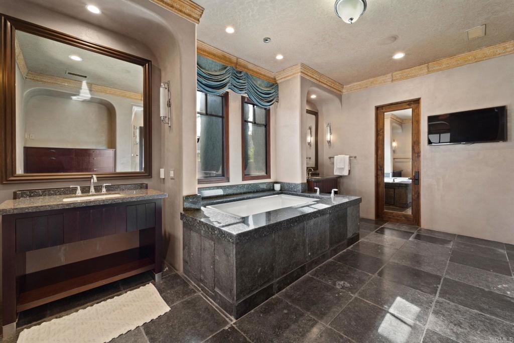 2908 Gate 5 Place Chula Vista, CA 91914 - Photo 37 of 63 a large bathroom with a sink and a large mirror