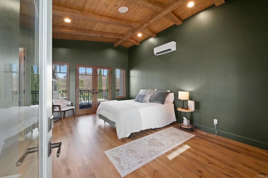 2908 Gate 5 Place Chula Vista, CA 91914 - Photo 43 of 63 a spacious bedroom with a bed and large windows