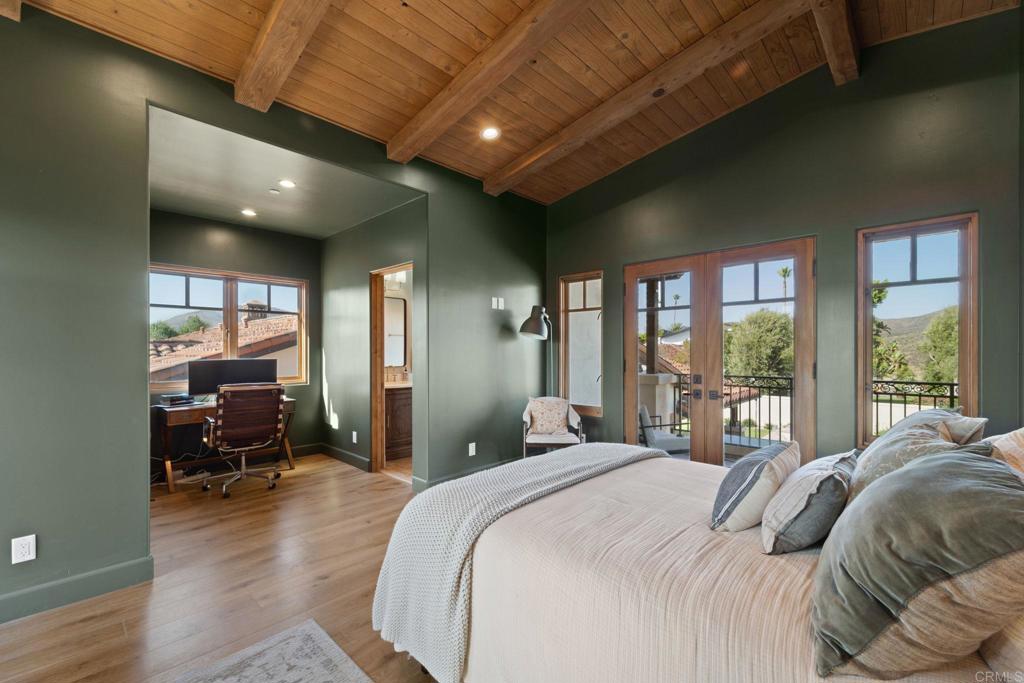 2908 Gate 5 Place Chula Vista, CA 91914 - Photo 44 of 63 a bedroom with furniture large window and a wooden floor