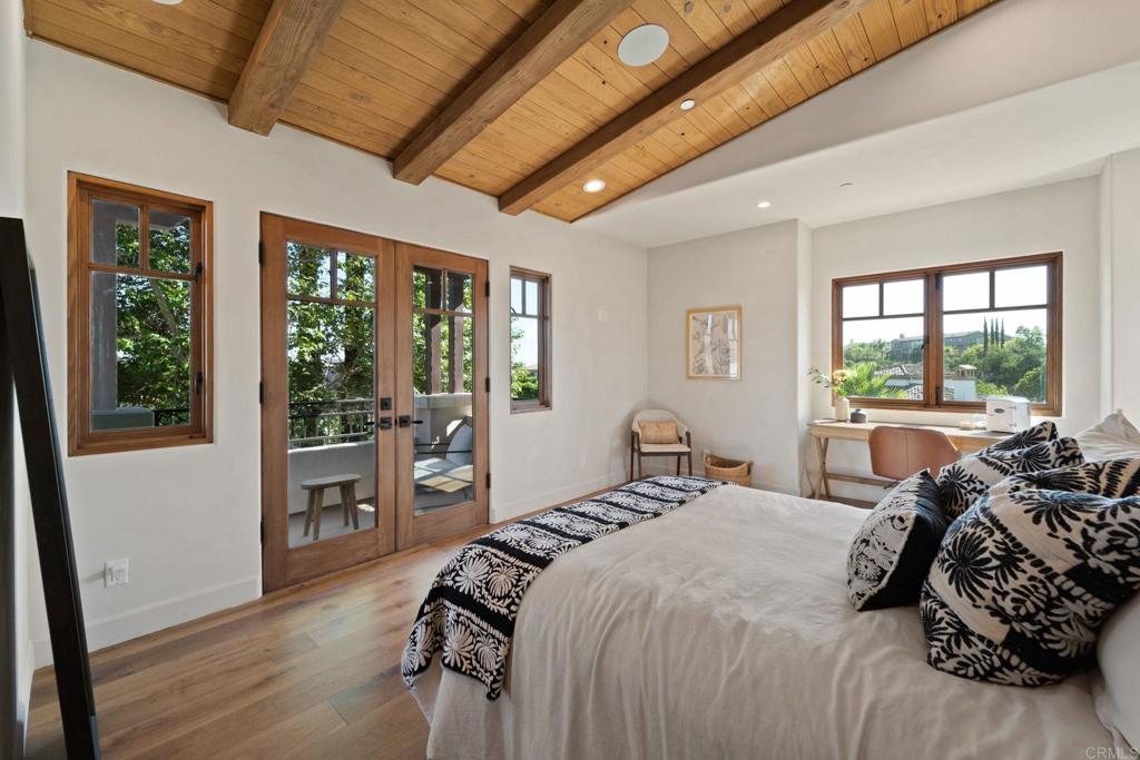 2908 Gate 5 Place Chula Vista, CA 91914 - Photo 45 of 63 a bedroom with a bed and wooden floor