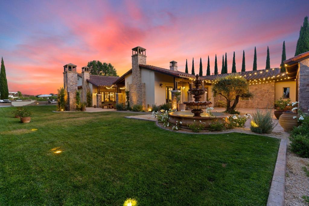 2908 Gate 5 Place Chula Vista, CA 91914 - Photo 57 of 63 a view of a big house with a big yard and a fountain