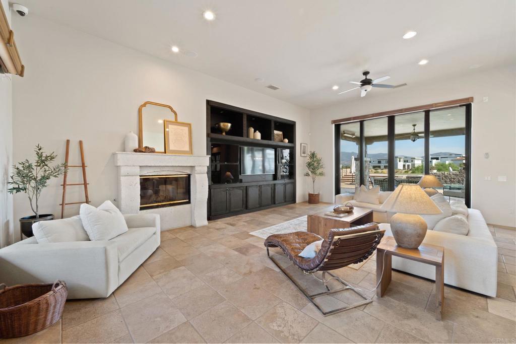 2908 Gate 5 Place Chula Vista, CA 91914 - Photo 62 of 63 a living room with furniture fireplace and flat screen tv