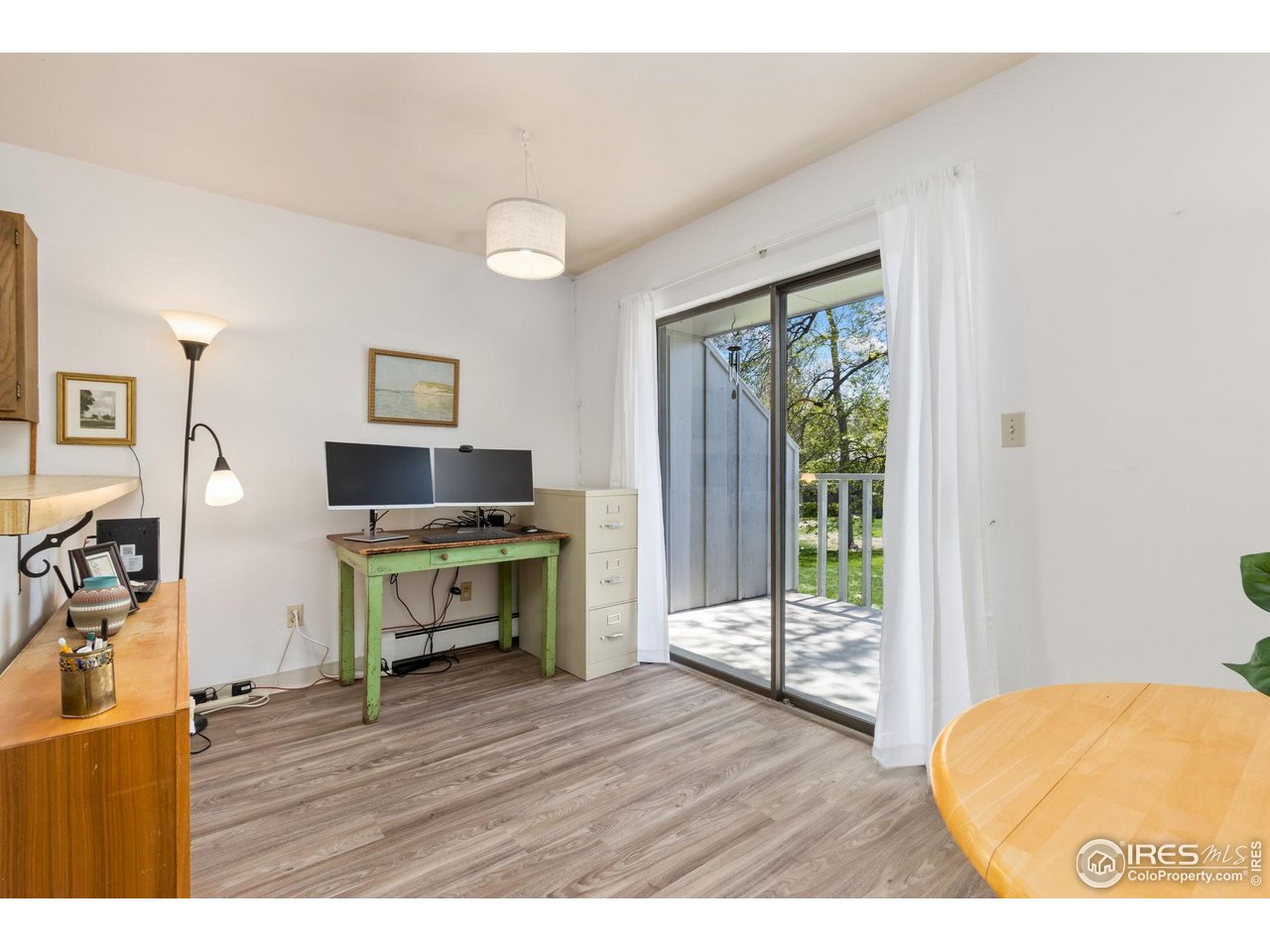 705 East Drake Road, Unit 22 Fort Collins, CO 80525 - Photo 5 of 18 The current owners are using the roomy dining area for both dining and an office.