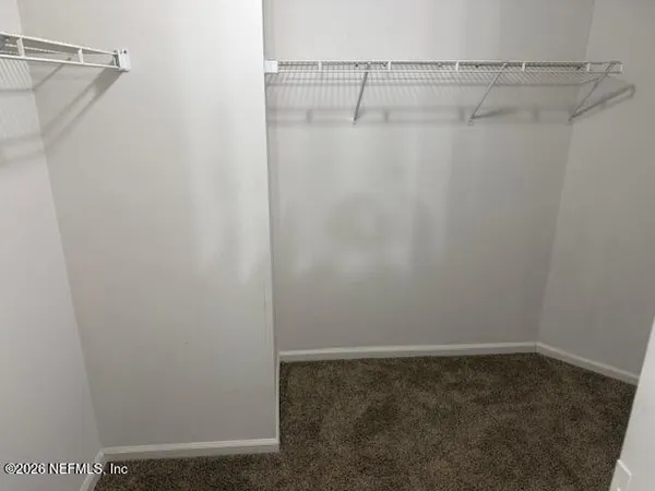 a view of a room with racks on the wall