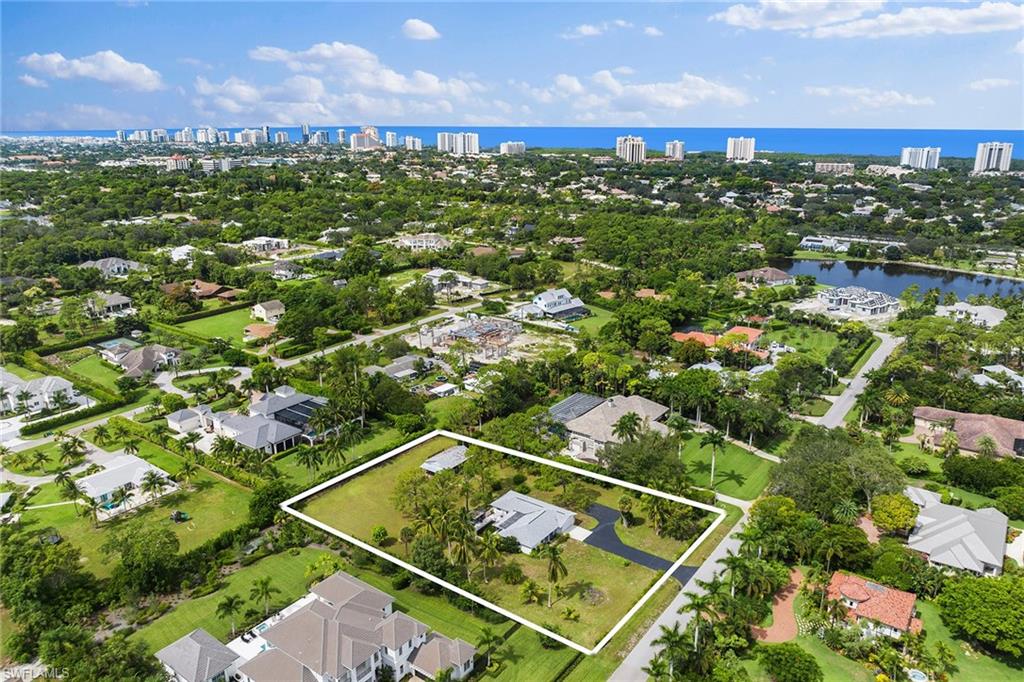 124 Eugenia Drive Naples, FL 34108 - Photo 13 of 20 a view of a tennis court