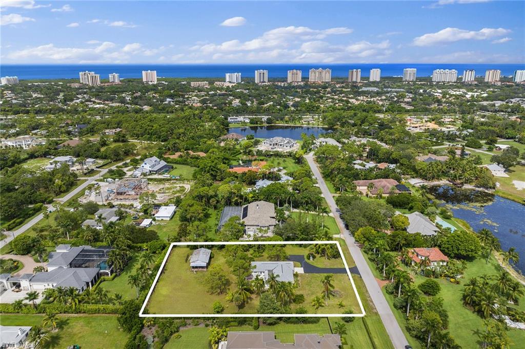 124 Eugenia Drive Naples, FL 34108 - Photo 14 of 20 a view of a tennis court