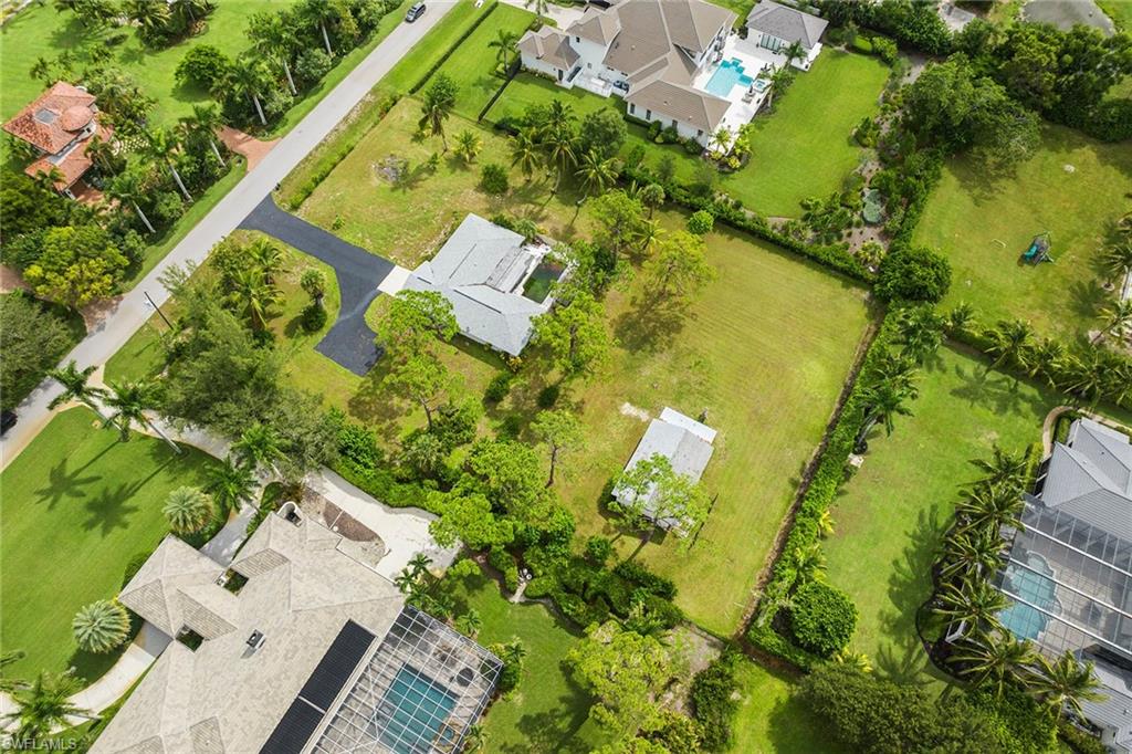 124 Eugenia Drive Naples, FL 34108 - Photo 16 of 20 an aerial view of a residential houses with outdoor space