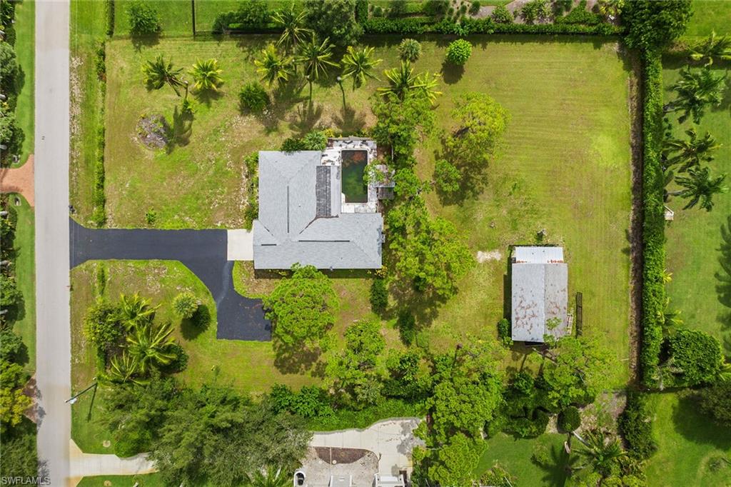 124 Eugenia Drive Naples, FL 34108 - Photo 2 of 20 an aerial view of a house with a yard