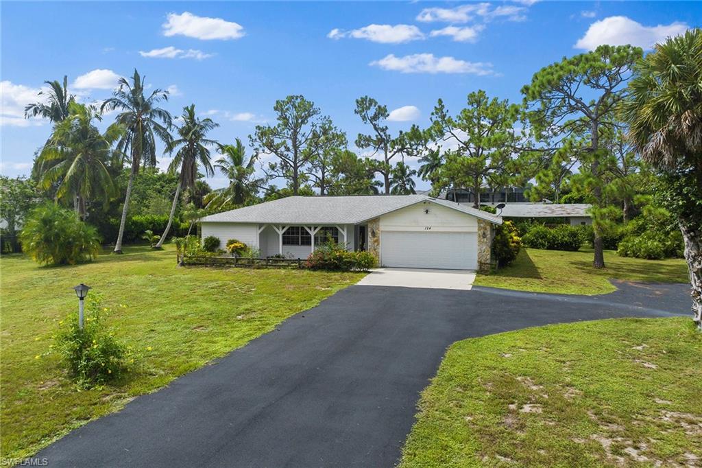 124 Eugenia Drive Naples, FL 34108 - Photo 7 of 20 a aerial view of a house with swimming pool and garden