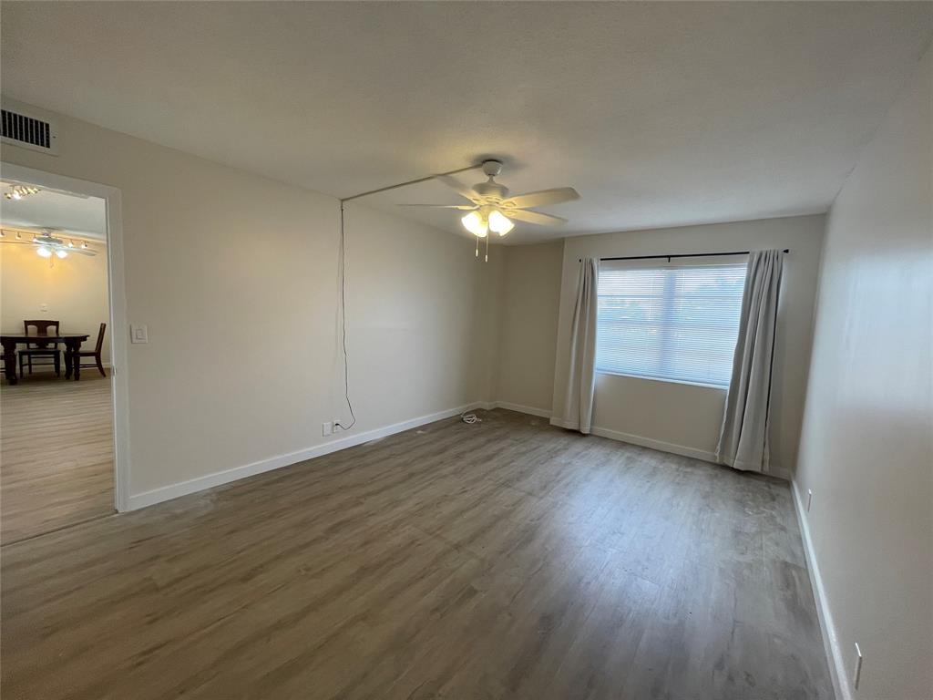 Undisclosed Address Fort Lauderdale, FL 33308 - Photo 15 of 28 an empty room with wooden floor and windows