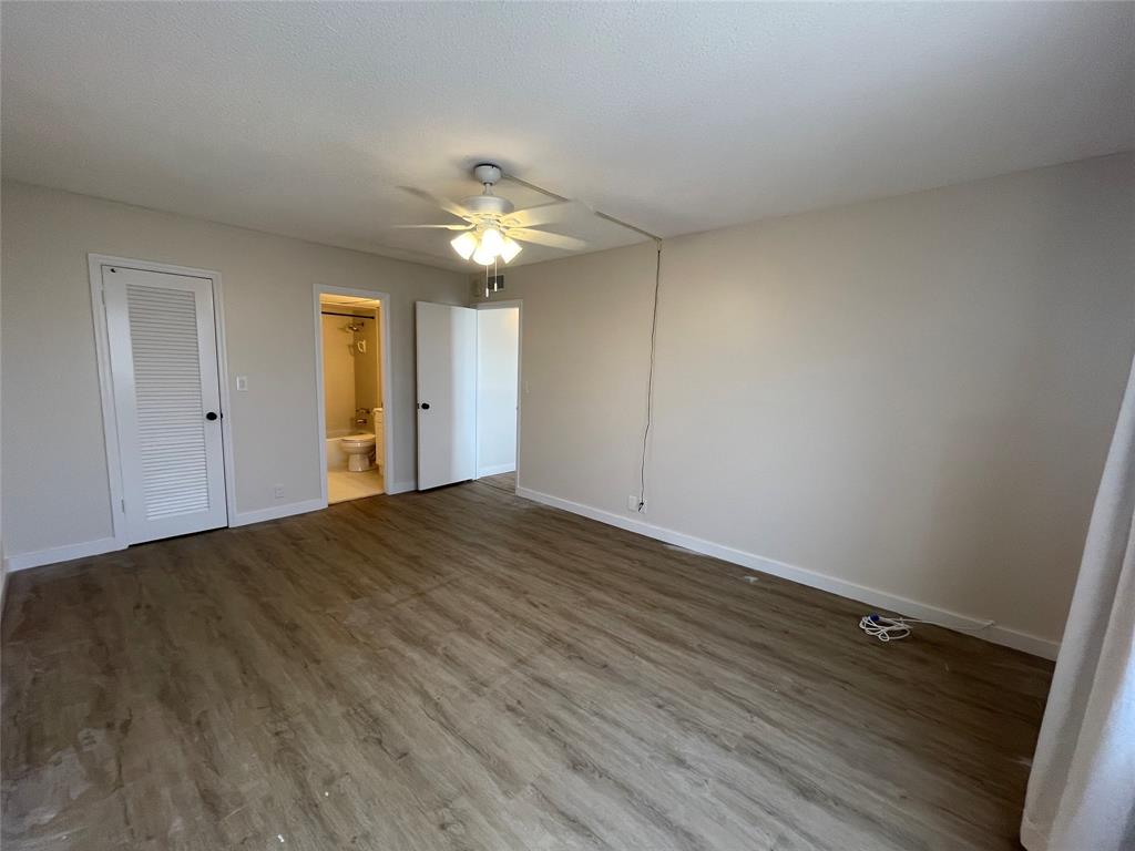 Undisclosed Address Fort Lauderdale, FL 33308 - Photo 17 of 28 a view of empty room with wooden floor and ceiling fan