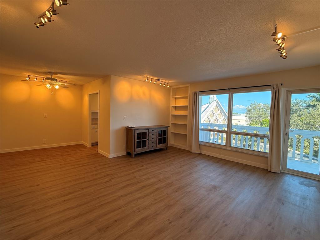 Undisclosed Address Fort Lauderdale, FL 33308 - Photo 5 of 28 a view of an empty room with wooden floor and a window