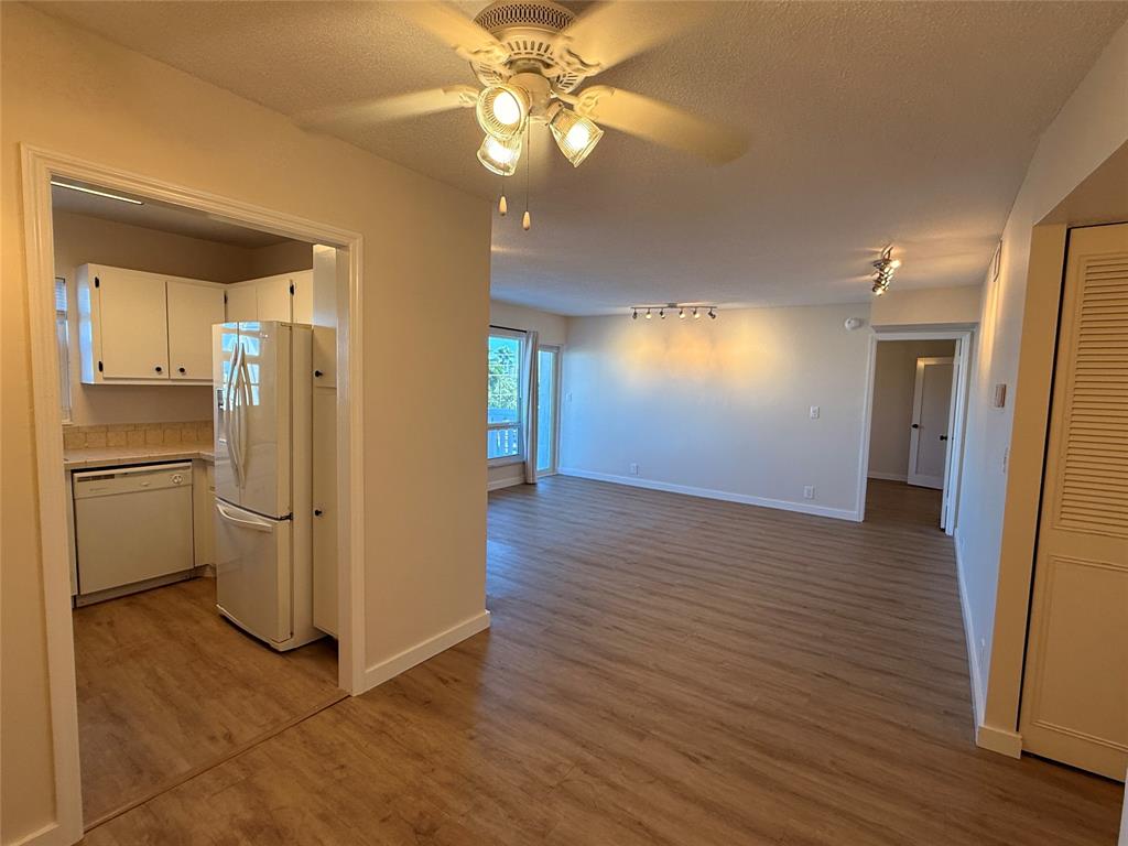 Undisclosed Address Fort Lauderdale, FL 33308 - Photo 6 of 28 a view of a kitchen with a refrigerator and a stove top oven