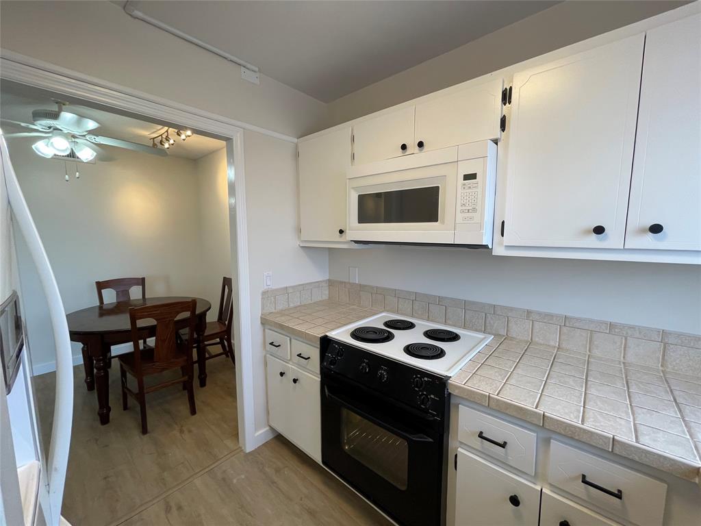 Undisclosed Address Fort Lauderdale, FL 33308 - Photo 9 of 28 a kitchen with cabinets appliances and a counter space