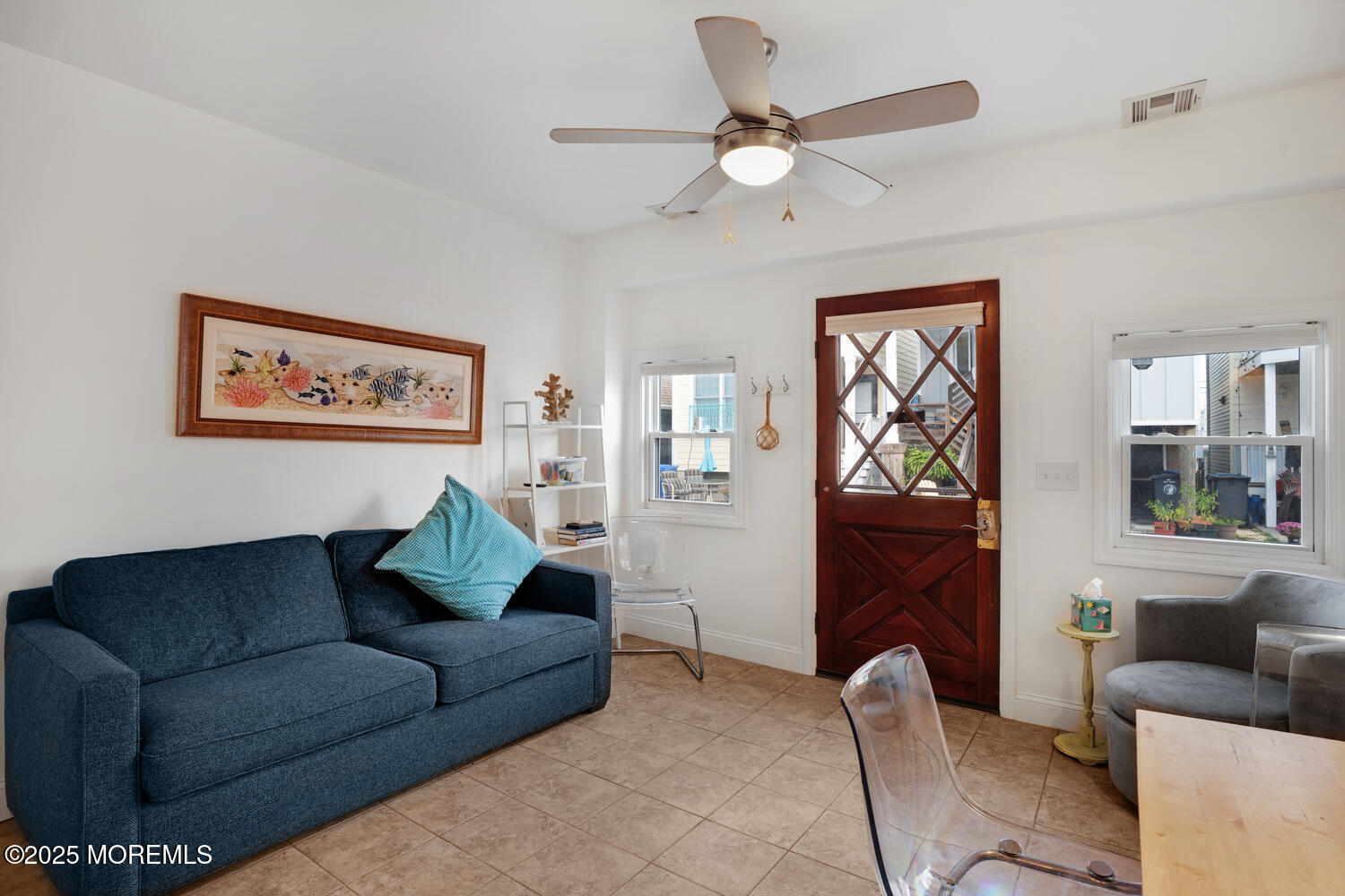 34 West Rutherford Lane Lavallette, NJ 08735 - Photo 12 of 27 a living room with furniture and a chandelier